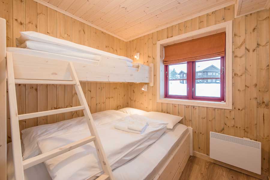 Slaapkamer met een stapelbed Rugdetunet appartementen