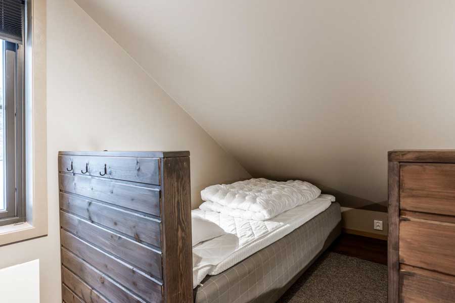 Slaapkamer met losse bedden in een Fjällvidd chalet