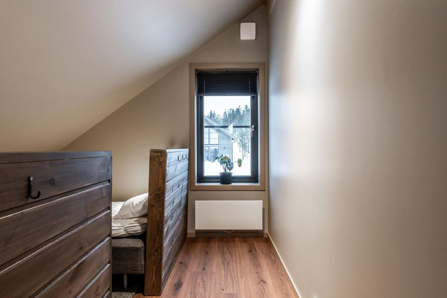 Slaapkamer met losse bedden in een Fjällvidd chalet