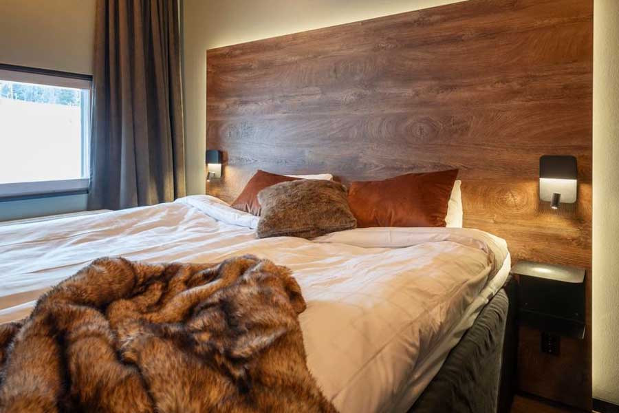 Slaapkamer met een tweepersoonsbed in een appartement van Skistar Lodge Lindvallen