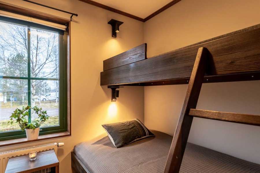 Slaapkamer met een stapelbed in een Ski Lodge Village appartement