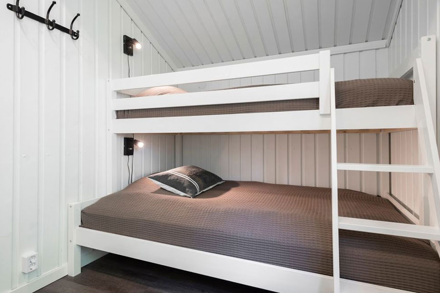 Slaapkamer met een stapelbed in een Bruna Byn chalet in Sälen