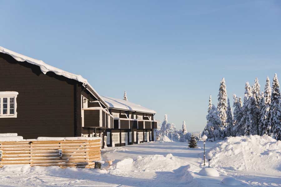 Gammelgården asppartementen in de sneeuw en winterzon